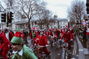 group of children in bicycle near white building